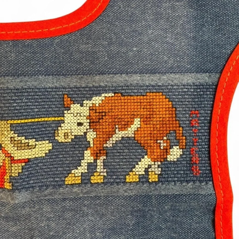 vintage Charles Craft denim cross-stitch baby‎ bib featuring a cowboy and calf